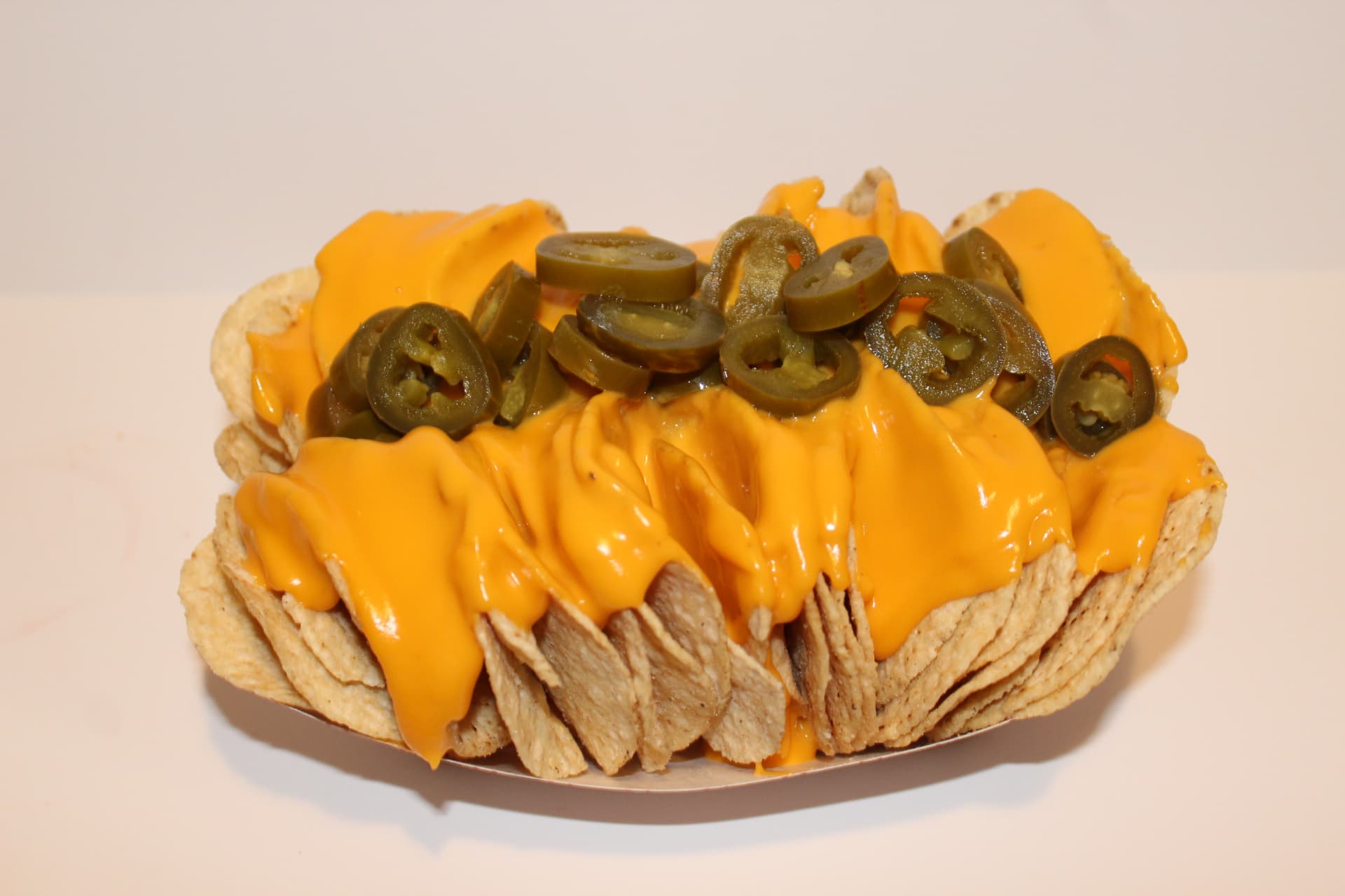 Nachos loaded with cheese and jalapeños